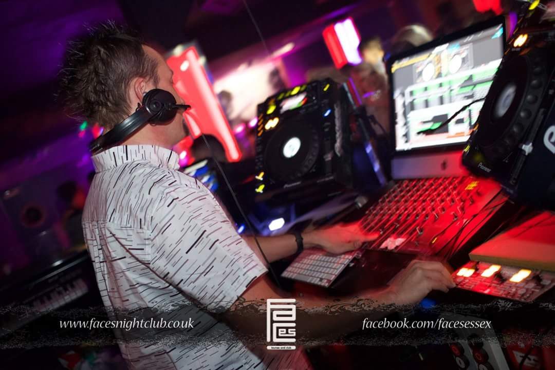 DJ Lite mixing on CDJs, red club lighting